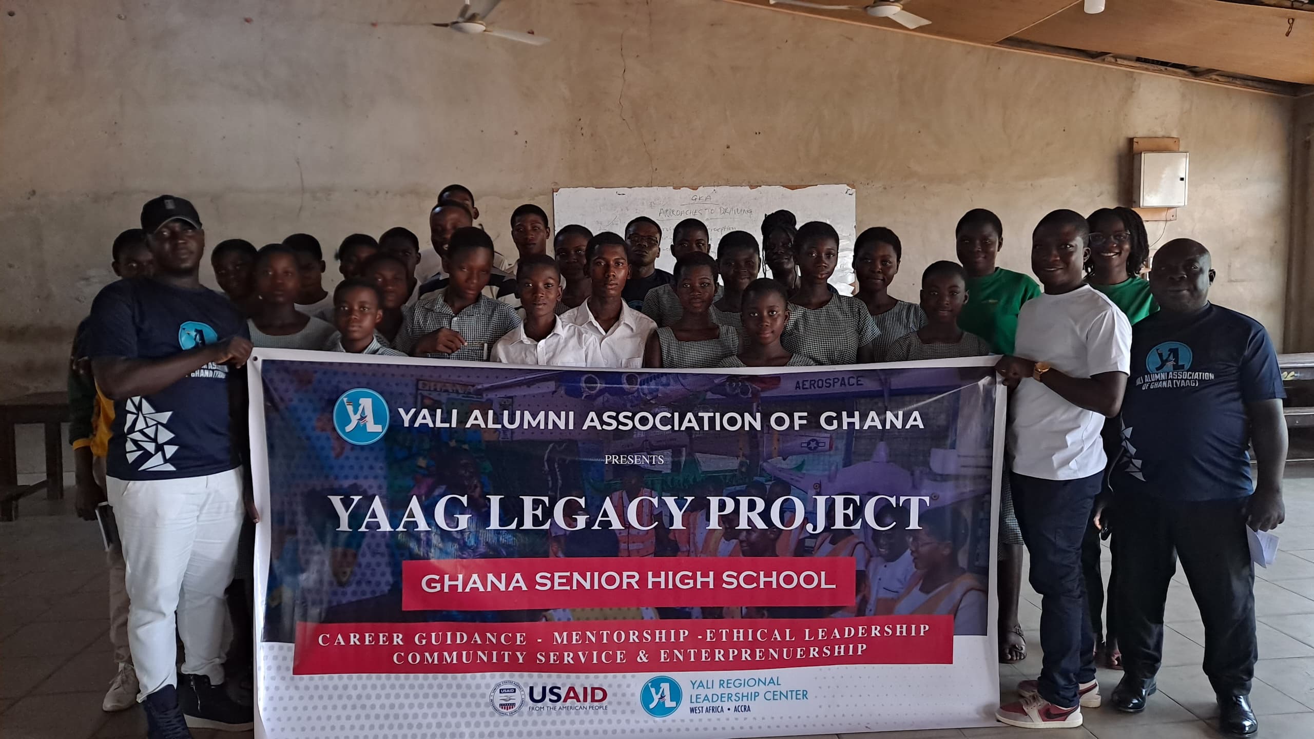YAAG Legacy Project participants hold the programme banner.